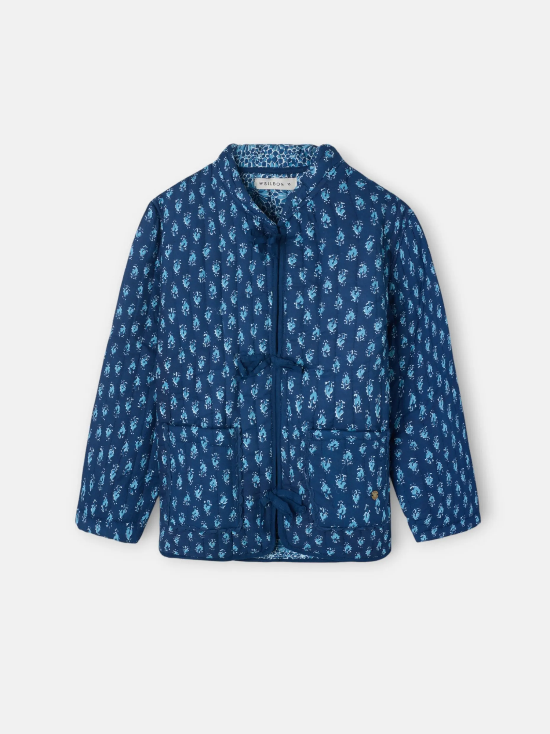 Chaqueta girl acolchada lazos estampado azul