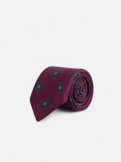Corbata seda motivo geometrico burdeos