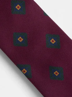 Corbata seda motivo geometrico burdeos