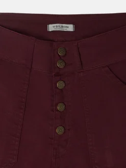Pantalon denim vuelta burdeos